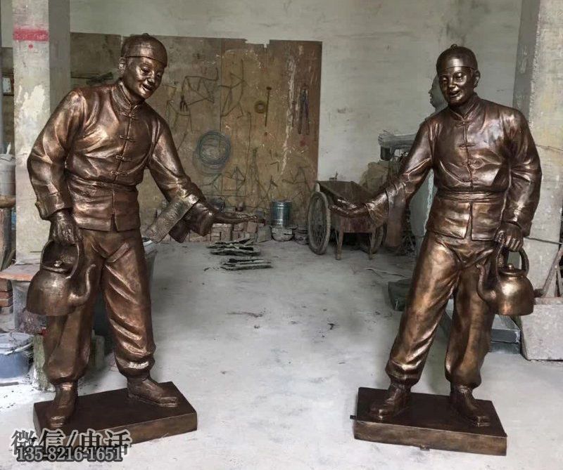 城市街道玻璃鋼店小二迎賓人物雕塑 城市街道玻璃鋼店小二迎賓人物雕塑